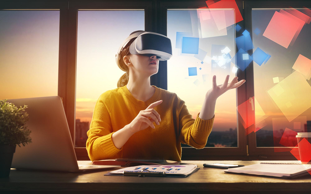 Virtual Reality in Business: woman with headseats in her desk